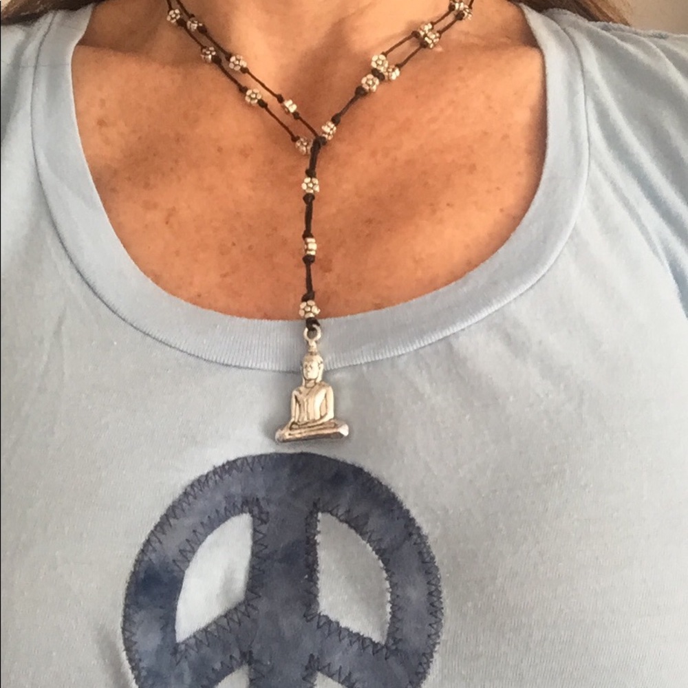 Silver sitting Buddha necklace.